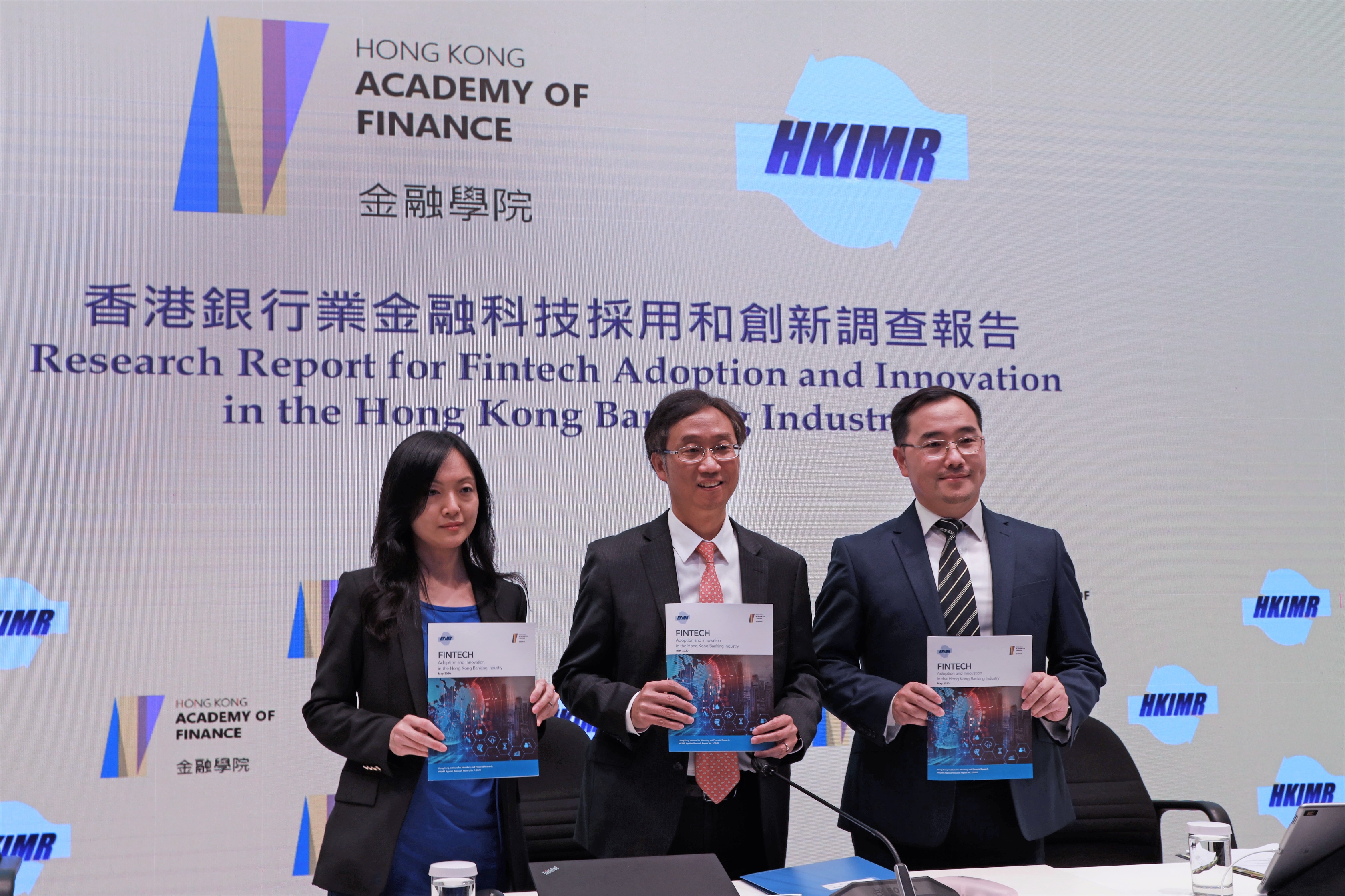 The Hong Kong Institute for Monetary and Financial Research (HKIMR), the research arm and subsidiary of the Hong Kong Academy of Finance (AoF), publishes the first in a series of Applied Research reports, titled “Fintech Adoption and Innovation in the Hong Kong Banking Industry”. Mr Edmond Lau, Senior Executive Director of the HKMA (centre), Ms Lillian Cheung, Executive Director (Research) (left) and Mr Colin Pou, Executive Director (Financial Infrastructure) (right), host a press conference to share the key findings of the report and the latest development of Fintech adoption in the Hong Kong banking industry.
